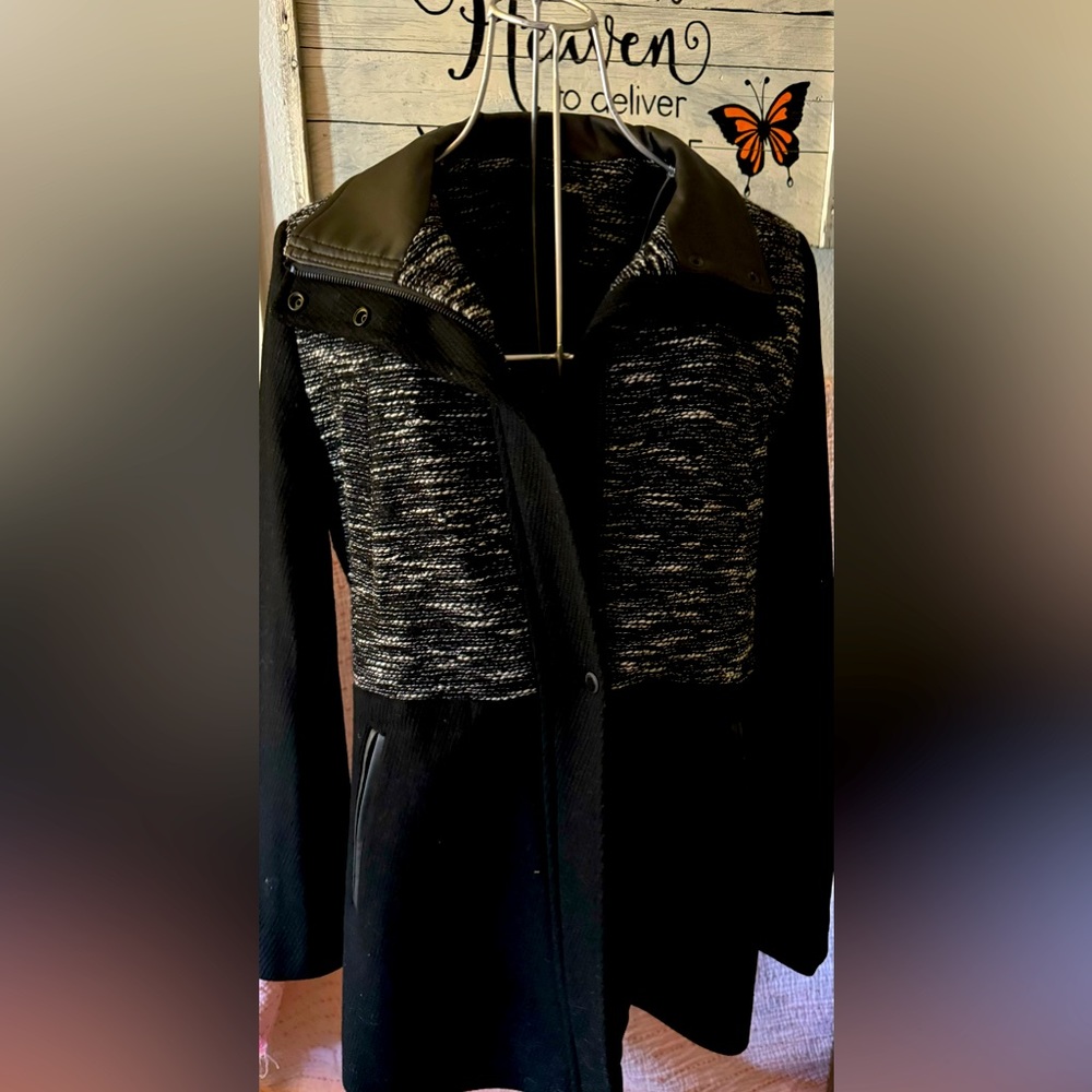 Back with white detail coat.  Approximately knee length.